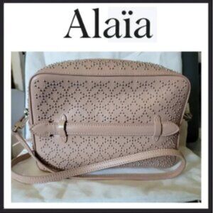 Alaia studded Arabesque across body bag in sable